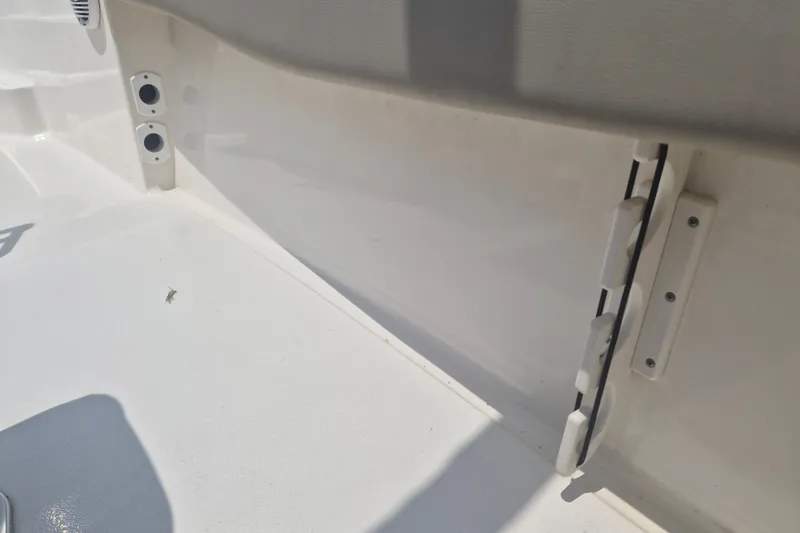 Slide: The Image of 2024 Key West 179 FS boat interior detail, showcasing clean white surface and fittings. - 8