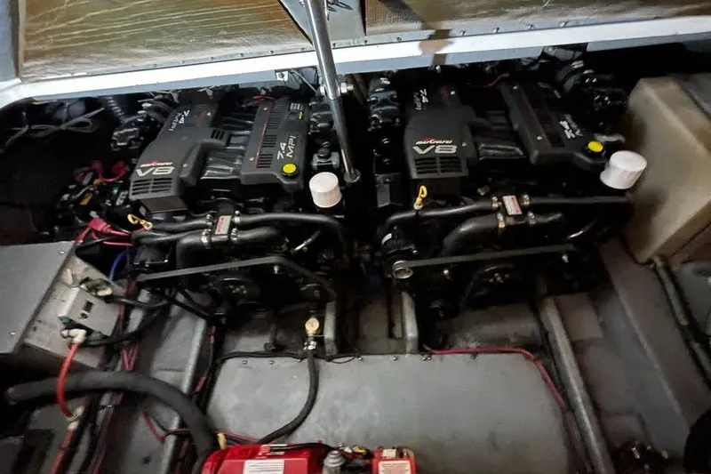 Slide: The Image of Twin V8 engines in a 1999 Sea Ray Sundancer 330 boat engine compartment. - 23