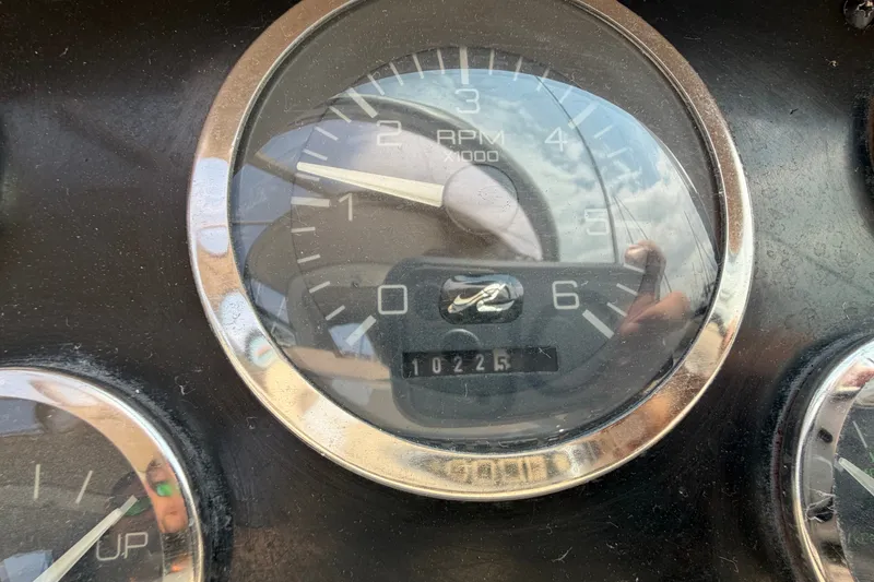 Slide: The Image of Close-up of a 1999 Sea Ray Sundancer 330 RPM gauge showing 10225 hours. - 22