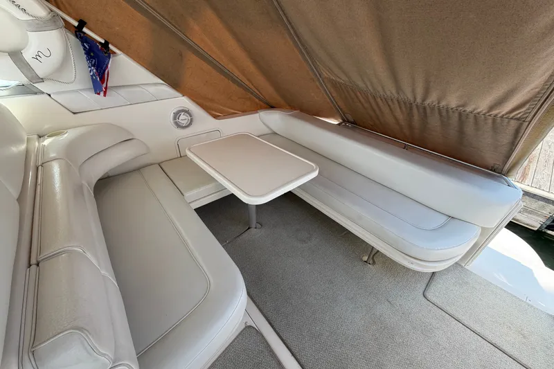 Slide: The Image of Interior seating area of a 1999 Sea Ray Sundancer 330 boat with beige upholstery. - 14