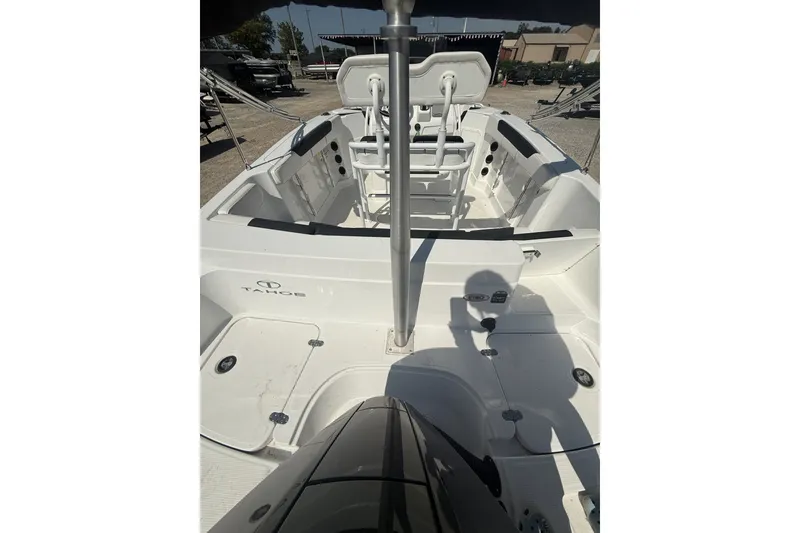 Slide: The Image of 2023 Tahoe 2150 CC boat interior with seating and storage compartments. - 7
