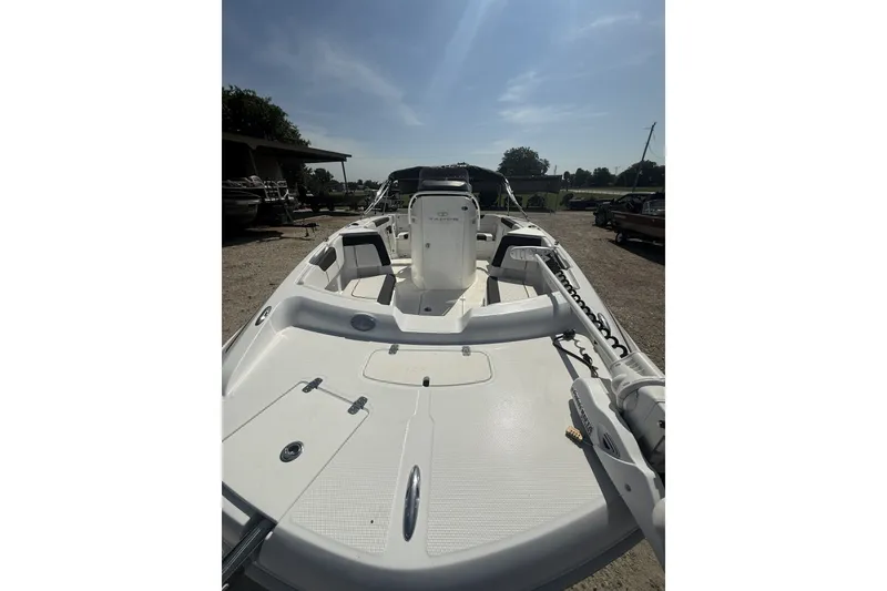 Slide: The Image of 2023 Tahoe 2150 CC boat, white deck, outdoor setting, sunny day. - 3