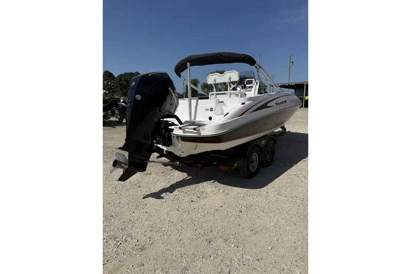 Slide: The Image of 2023 Tahoe 2150 CC boat on trailer, featuring sleek design and powerful outboard motor. - 6