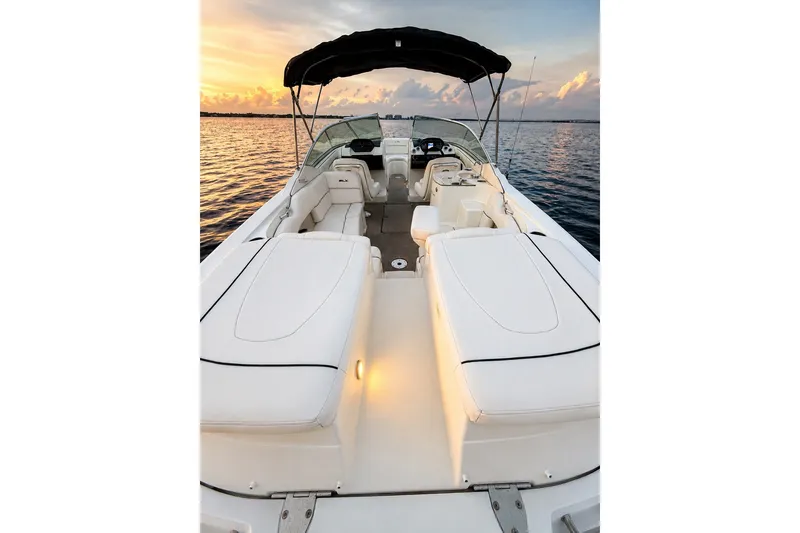 Slide: The Image of 2006 Sea Ray 270 SLX boat interior at sunset on calm water. - 21