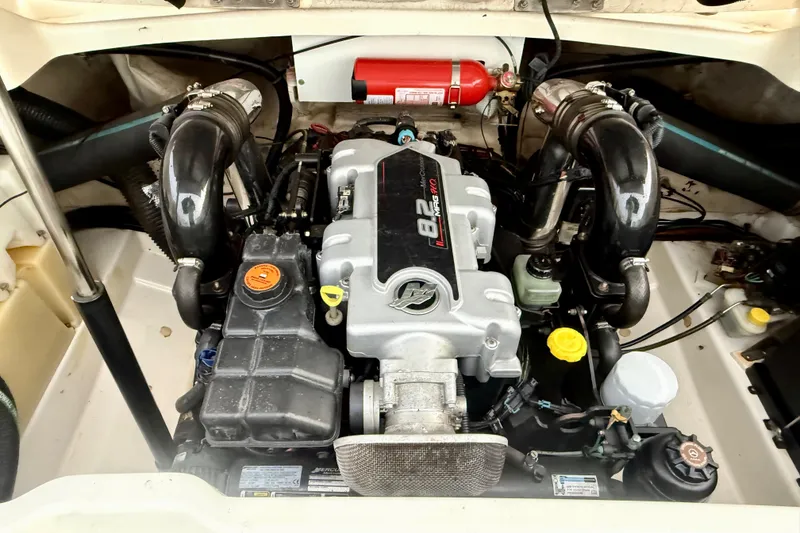 Slide: The Image of Engine compartment of a 2006 Sea Ray 270 SLX boat, featuring a MerCruiser 8.2 engine. - 36