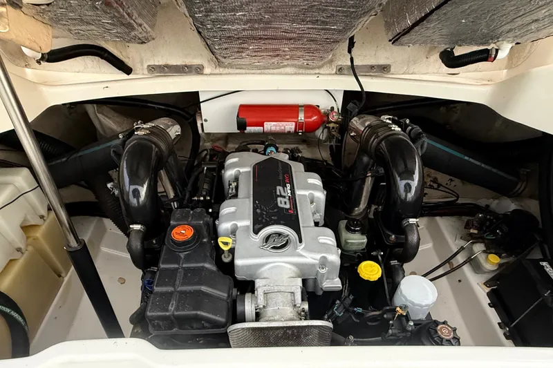 Slide: The Image of Engine compartment of a 2006 Sea Ray 270 SLX boat, featuring a powerful engine. - 35