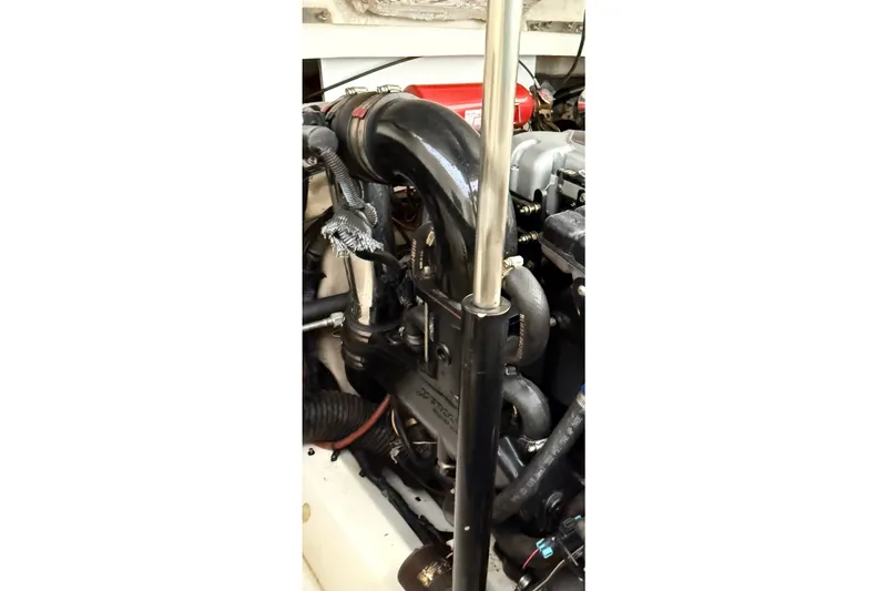 Slide: The Image of Engine compartment of a 2006 Sea Ray 270 SLX boat, showcasing mechanical components. - 38