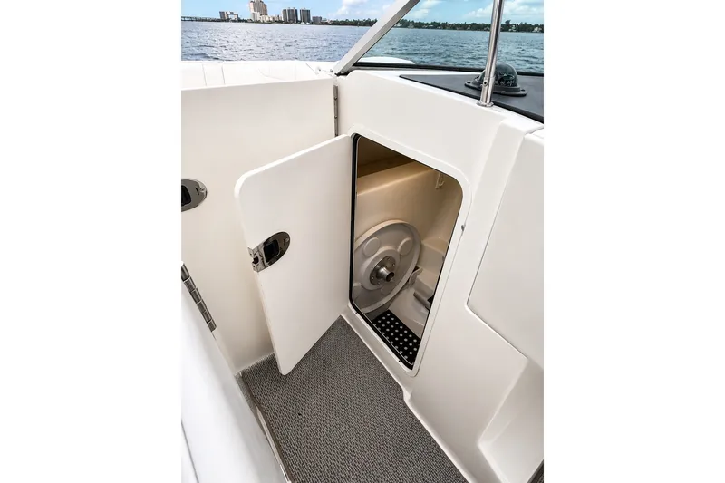 Slide: The Image of Open storage compartment on 2006 Sea Ray 270 SLX boat with ocean view. - 14