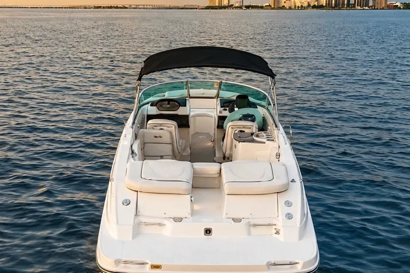 Slide: The Image of 2006 Sea Ray 270 SLX boat on calm water, featuring spacious seating and sleek design. - 6