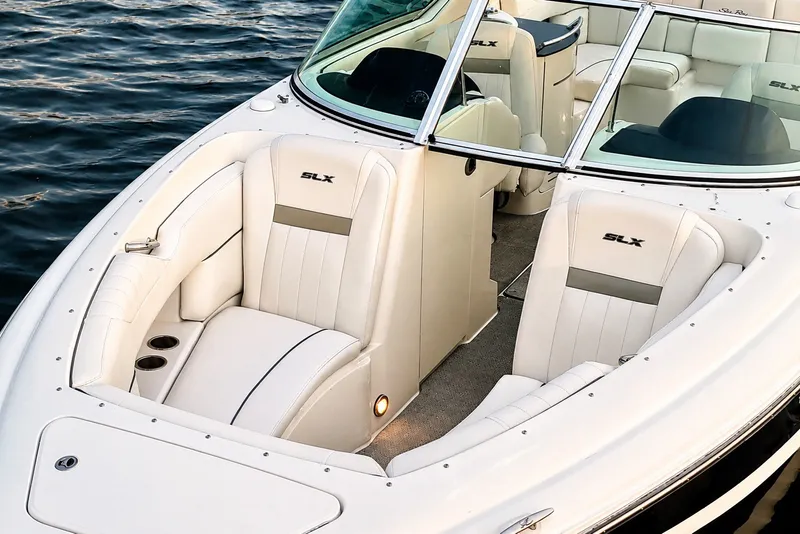 Slide: The Image of 2006 Sea Ray 270 SLX boat interior with white seating and open water view. - 30