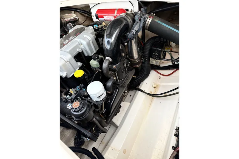 Slide: The Image of Engine compartment of a 2006 Sea Ray 270 SLX boat, showcasing mechanical components. - 39