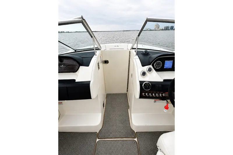 Slide: The Image of Interior view of 2006 Sea Ray 270 SLX boat cockpit with steering controls. - 13