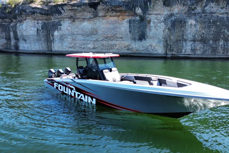 Slide: The Image of 2024 Fountain 38 SC boat on water near rocky cliff. - 3