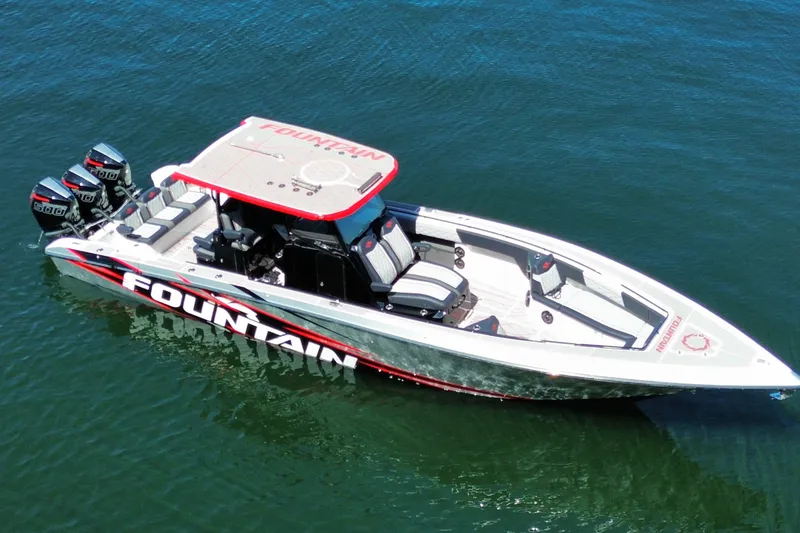 Slide: The Image of 2024 Fountain 38 SC boat with triple engines on calm water. - 4