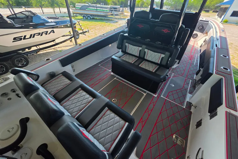 Slide: The Image of 2024 Fountain 38 SC boat interior with stylish seating and modern design. - 8