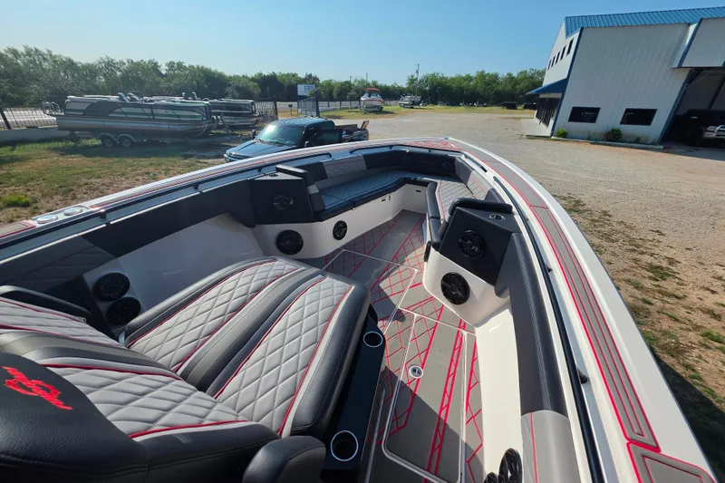 Slide: The Image of 2024 Fountain 38 SC boat interior with luxurious seating and modern design. - 11