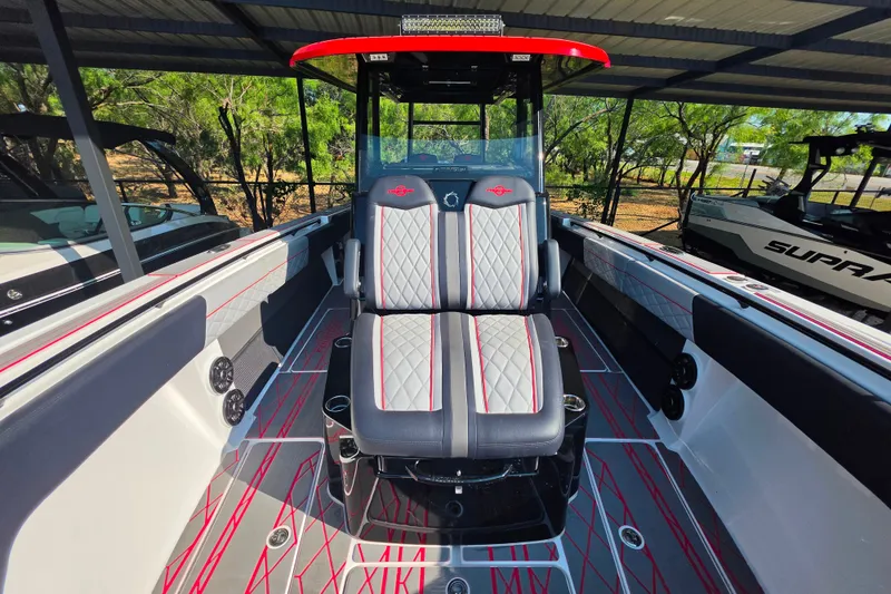 Slide: The Image of 2024 Fountain 38 SC boat interior with stylish seating and modern design. - 12