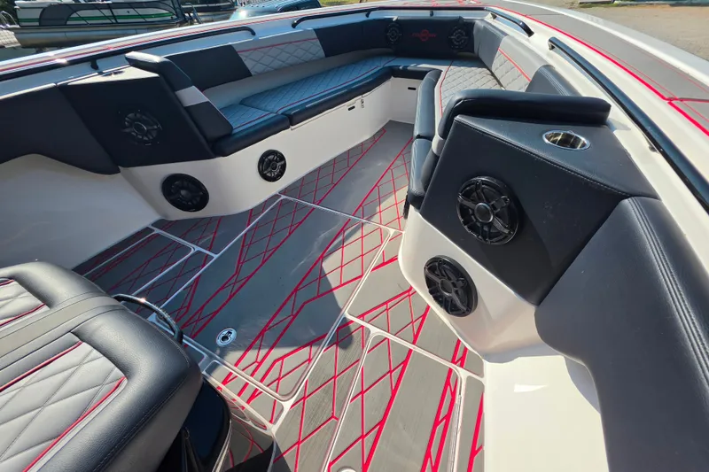 Slide: The Image of 2024 Fountain 38 SC boat interior with stylish seating and modern speaker system. - 15