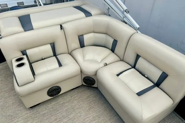 Slide: The Image of Luxurious seating on 2017 Landau Island Breeze 212 Cruise pontoon boat with cup holders and speakers. - 7