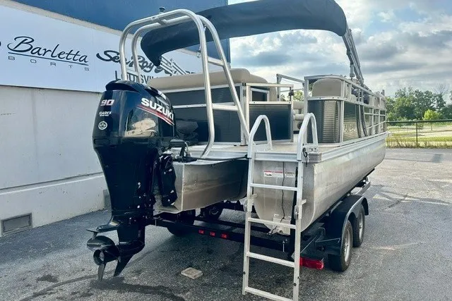 Slide: The Image of 2017 Landau Island Breeze 212 Cruise pontoon boat with Suzuki 90 engine on trailer. - 3