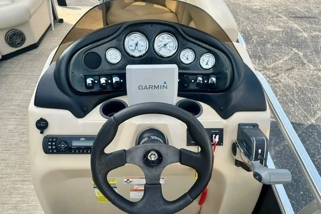 Slide: The Image of 2017 Landau Island Breeze 212 Cruise dashboard with Garmin GPS and steering wheel. - 9