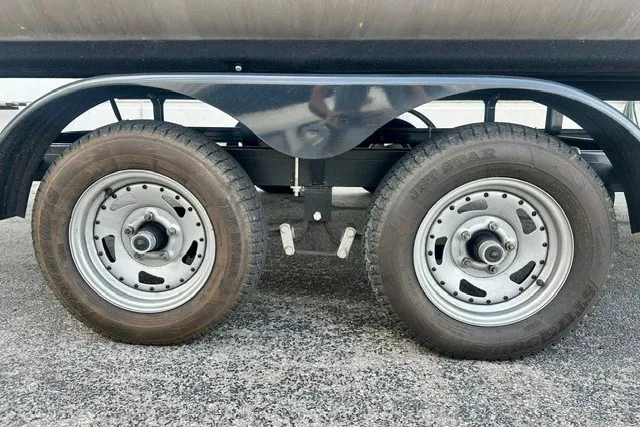 Slide: The Image of Trailer wheels of a 2017 Landau Island Breeze 212 Cruise pontoon boat. - 15