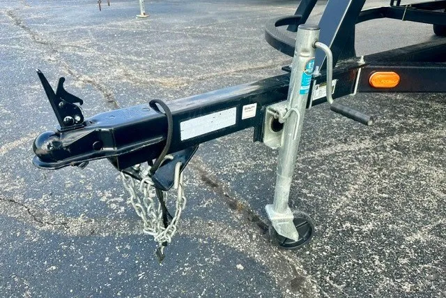 Slide: The Image of Trailer hitch and jack stand of a 2017 Landau Island Breeze 212 Cruise boat. - 16