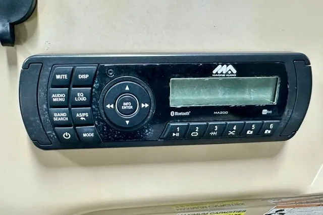 Slide: The Image of Marine audio system on a 2017 Landau Island Breeze 212 Cruise boat dashboard. - 10