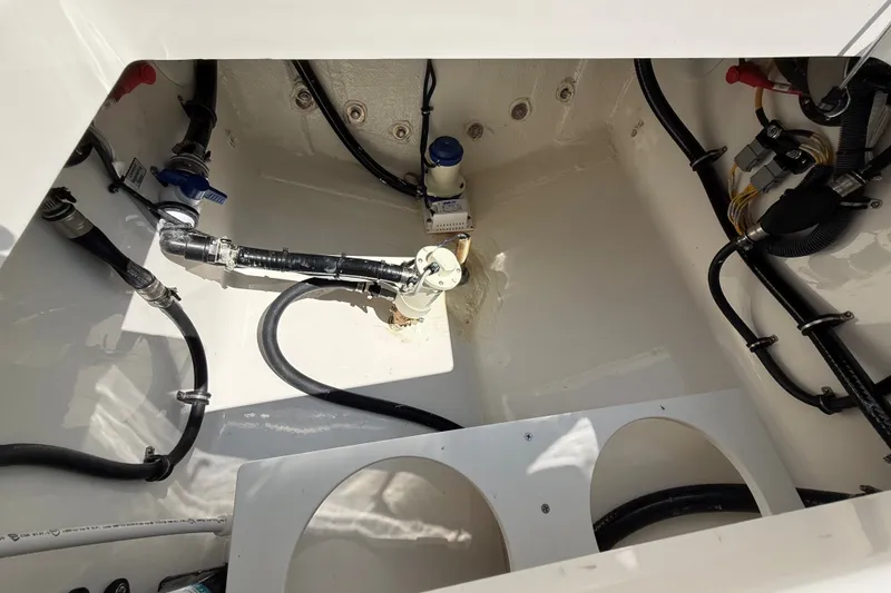 Slide: The Image of A clean, well-organized engine compartment with hoses and valves. - 21