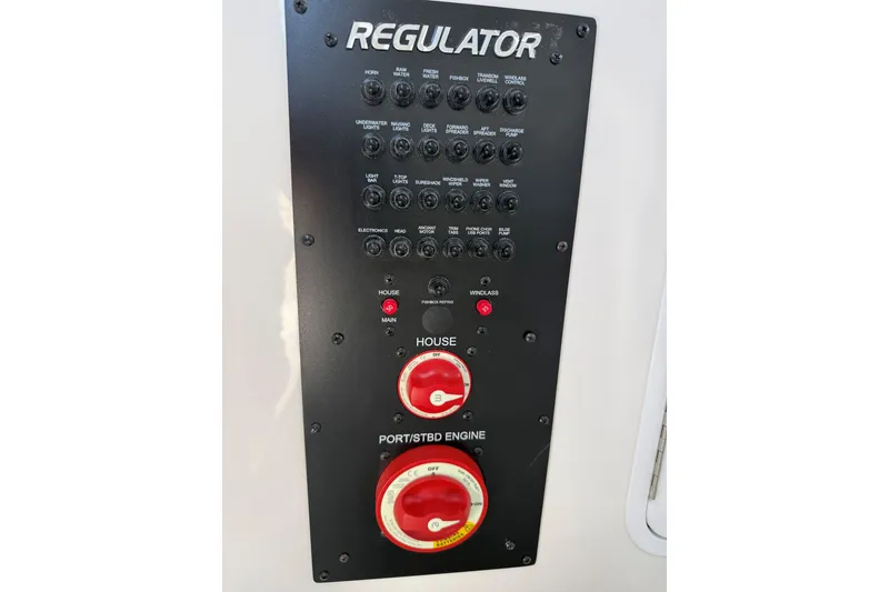 Slide: The Image of Control panel of 2024 Regulator 28 boat, featuring switches and dials for various functions. - 29
