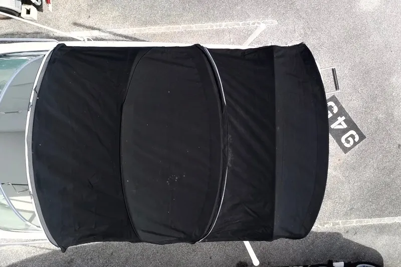 Slide: The Image of Overhead view of 2010 Sea Ray 240 Sundancer with black canvas cover. - 13