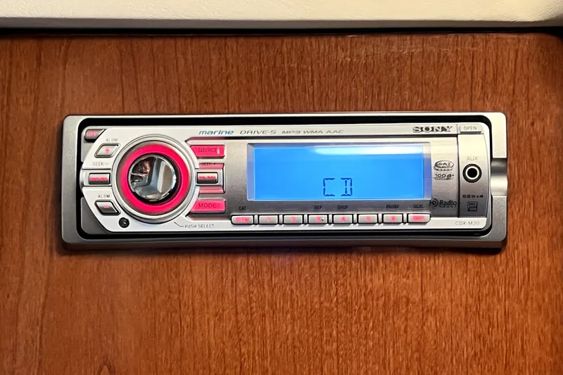 Slide: The Image of Sony marine stereo system on 2010 Sea Ray 240 Sundancer boat, displaying "CD" on screen. - 78