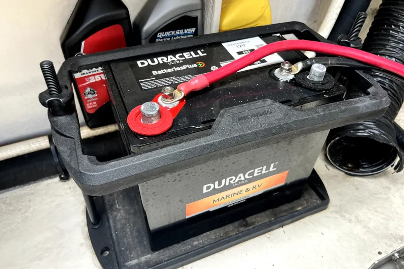 Slide: The Image of Duracell marine battery in a 2010 Sea Ray 240 Sundancer boat engine compartment. - 18
