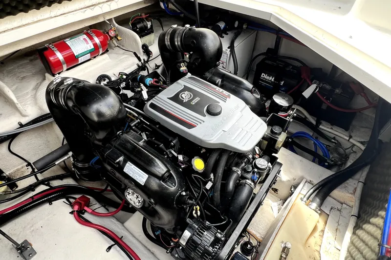 Slide: The Image of Engine compartment of a 2010 Sea Ray 240 Sundancer boat with visible fire extinguisher. - 55