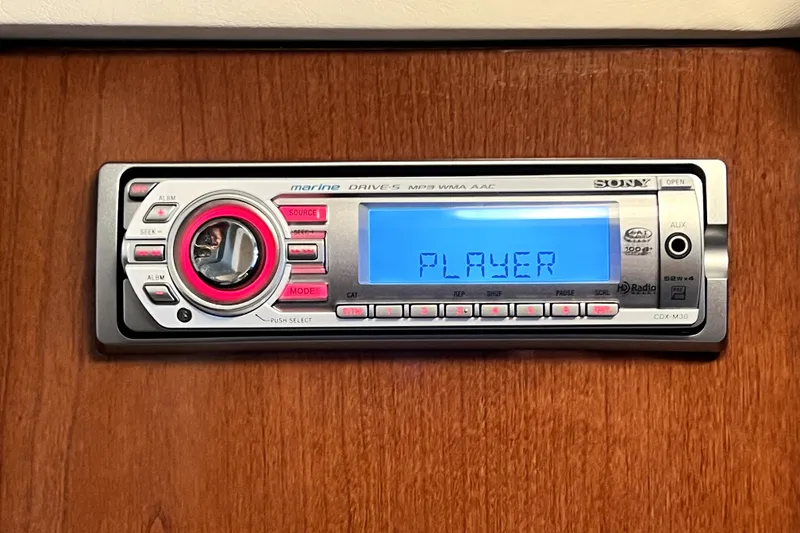 Slide: The Image of Sony marine stereo system on 2010 Sea Ray 240 Sundancer boat dashboard. - 77