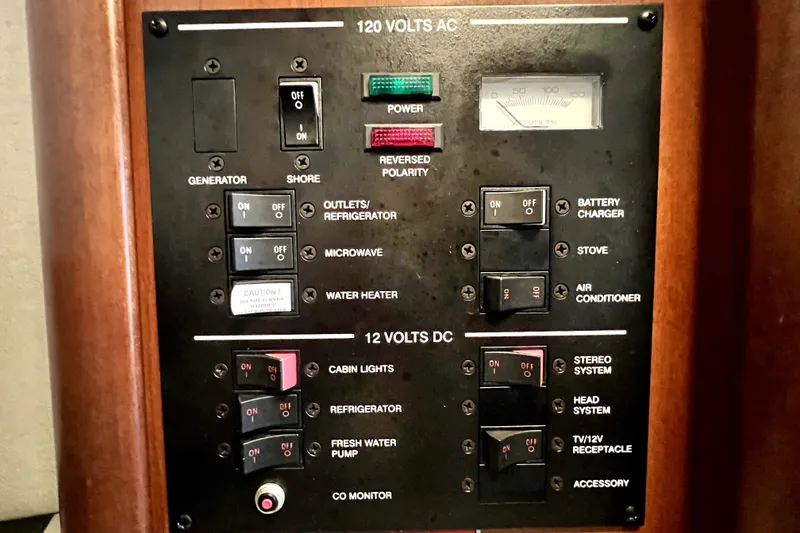 Slide: The Image of Electrical control panel on a 2010 Sea Ray 240 Sundancer boat. - 79