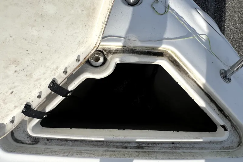 Slide: The Image of Open storage compartment on a 2010 Sea Ray 240 Sundancer boat. - 81