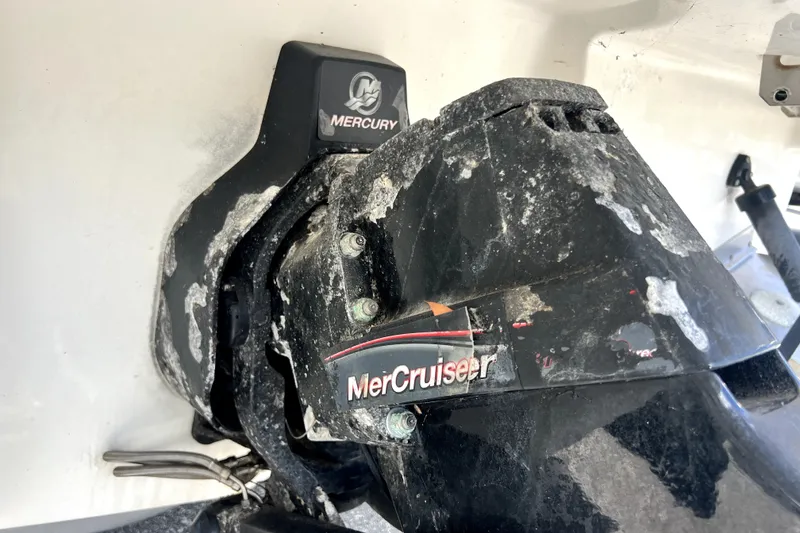 Slide: The Image of MerCruiser engine on 2010 Sea Ray 240 Sundancer, showing wear and corrosion. - 29