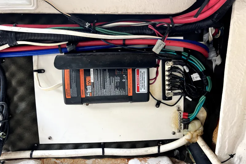 Slide: The Image of Electrical wiring and components inside a 2010 Sea Ray 240 Sundancer boat. - 17