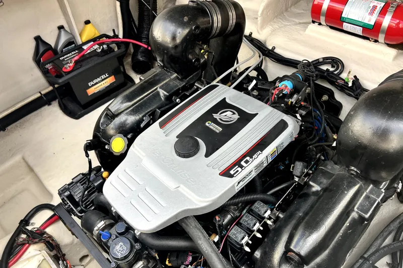 Slide: The Image of Engine compartment of a 2010 Sea Ray 240 Sundancer with a 5.0 MPI MerCruiser engine. - 22