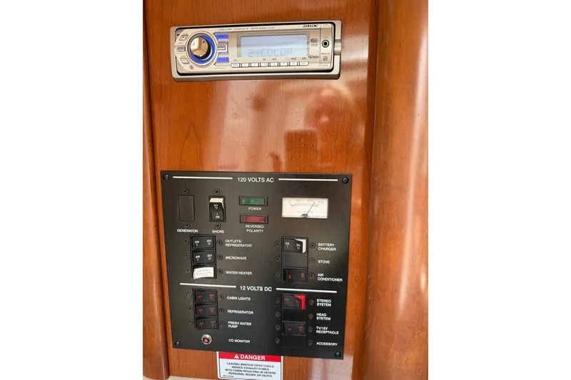 Slide: The Image of Control panel of a 2010 Sea Ray 240 Sundancer boat with stereo system. - 17