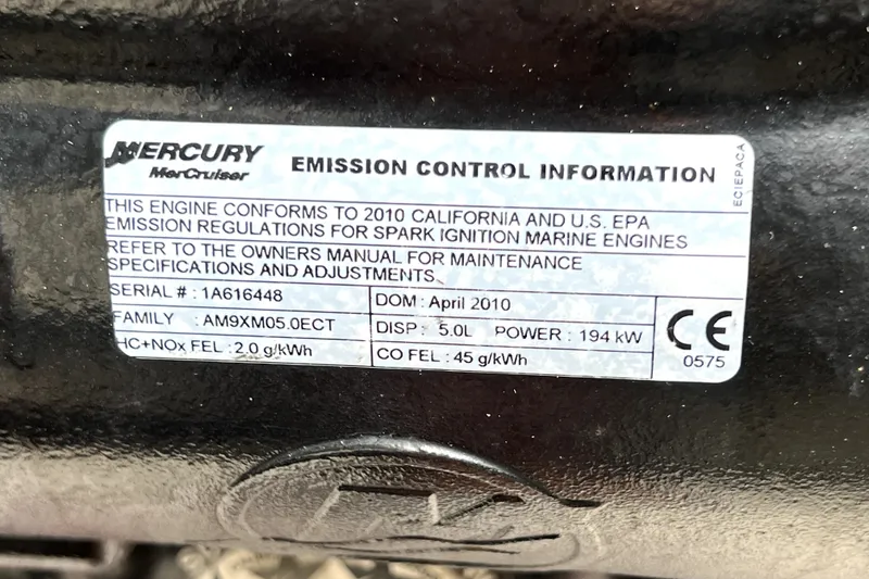 Slide: The Image of Mercury MerCruiser emission label on 2010 Sea Ray 240 Sundancer engine, detailing compliance and specifications. - 54