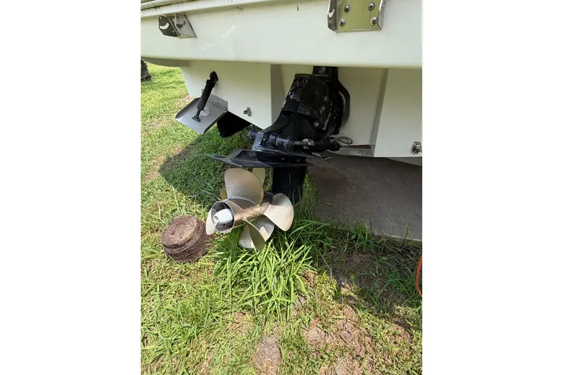 Slide: The Image of Rear view of a 2010 Sea Ray 240 Sundancer boat propeller on grass. - 14