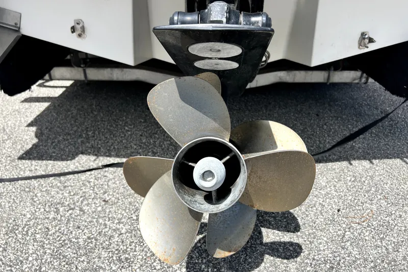 Slide: The Image of Propeller of a 2010 Sea Ray 240 Sundancer boat on pavement. - 27