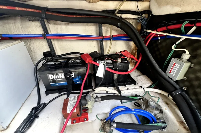 Slide: The Image of Engine compartment of 2010 Sea Ray 240 Sundancer with DieHard marine batteries and wiring. - 52