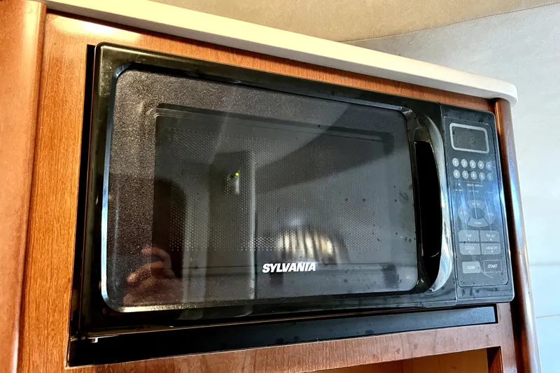 Slide: The Image of Sylvania microwave installed in a 2010 Sea Ray 240 Sundancer boat kitchen. - 76