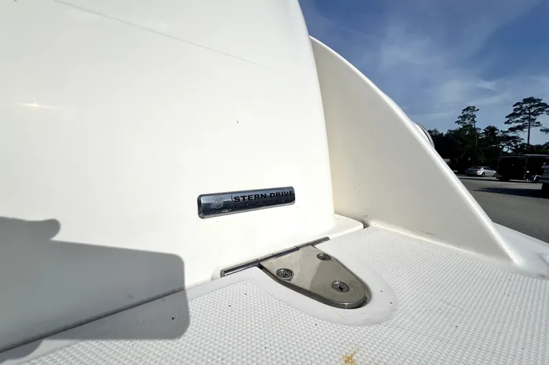 Slide: The Image of 2010 Sea Ray 240 Sundancer stern drive detail under clear blue sky. - 63
