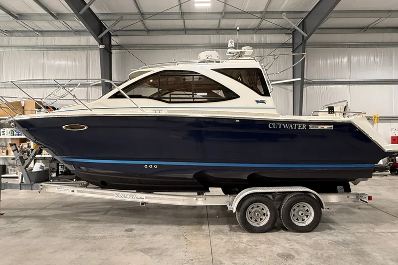 The Image of 2016 Cutwater C-24 boat on trailer in indoor storage facility. - 0