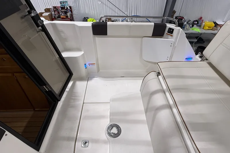 Slide: The Image of Interior view of a 2016 Cutwater C-24 boat, featuring seating and storage areas. - 16