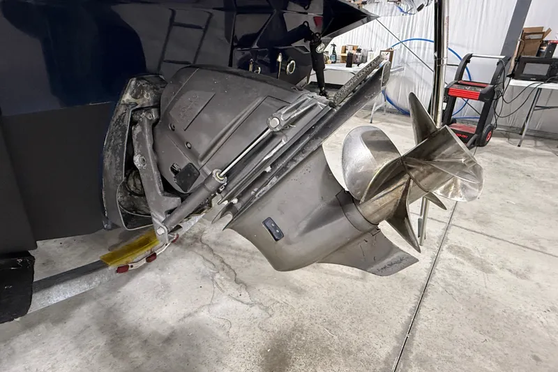 Slide: The Image of Close-up of a 2016 Cutwater C-24 boat propeller in a garage setting. - 6